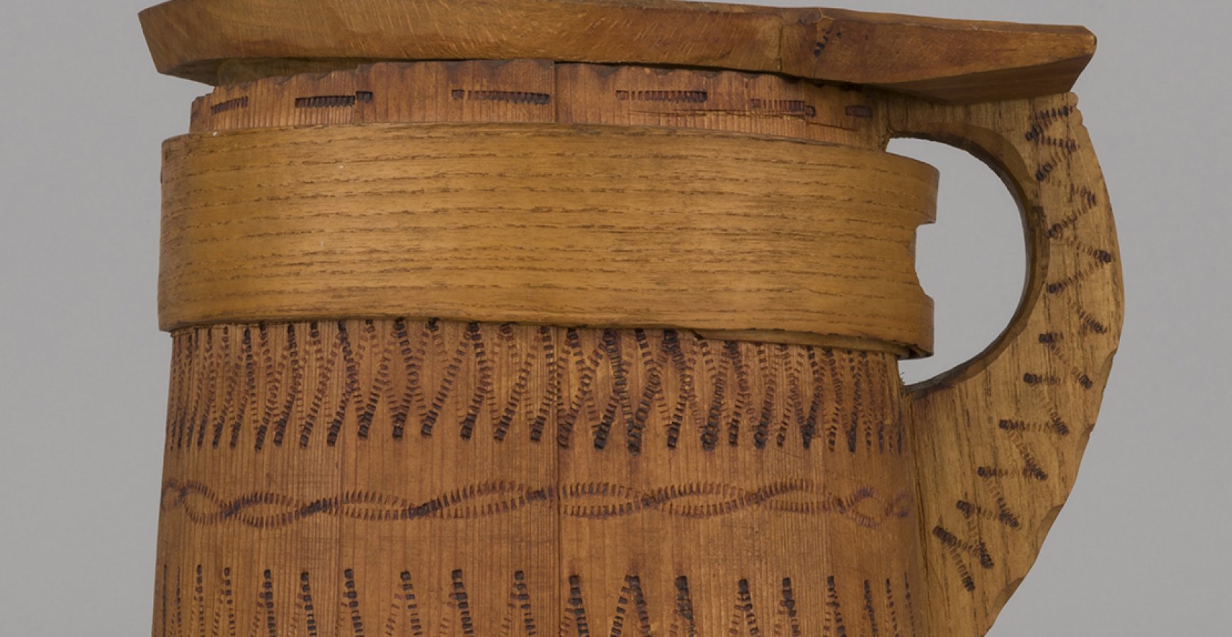 a wooden watering can from the Hutsul region