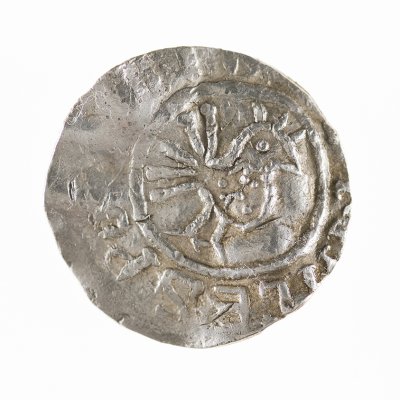 silver coin with a bird